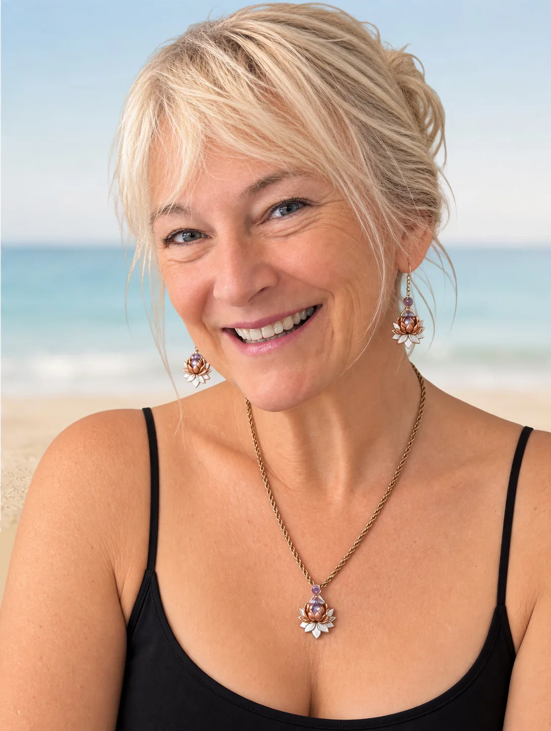 Lorayne, Maui artist and designer, wearing her Lotus pendant and earrings